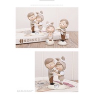Decorative statue 3x8,5cm set2 Couple wearing bunny ears hat pulling cute violin
