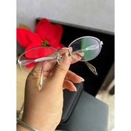 There is a box of eyeglass frames to replace eyes, made of light purple stainless material, 13 cm lo