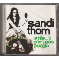 CD SANDI THOM : SMILE IT CONFUSES PEOPLE ( ORIGINAL CD )