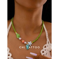 Green necklace with porcelain fish face VC25