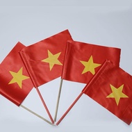 Hand-held flags, hand-held Vietnamese flags, small flags, waving flags