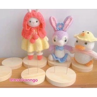 Wooden base holds stuffed animals