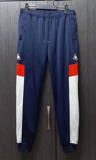 正品LE COQ SPORTIF 男拼色腰抽繩縮口休閒長褲OX