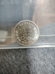 1964年日本東京奧運銀幣1000日元。5元平郵