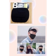 Plain black cotton washable face mask for adult on hand