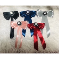 Bow brooches come in many colors. Size 10x15cm. Accept designs according to customer requirements