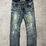 VAGADENIM faded disstressed jeans
