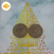 Uang logam 500 rupiah melati tahun 1992. 
Gambar melati besar