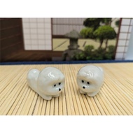 Ceramic chopstick rests, set of 2, featuring a cute Bichon Frise dog figurine.