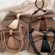 BUM.BA.LA.BUM checkered bow shoulder bag