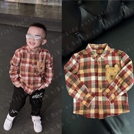 George boy's red checkered shirt [aut]