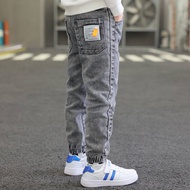 Boy's loose Korean version of foreign air bundle foot elastic casual jeans and trousers