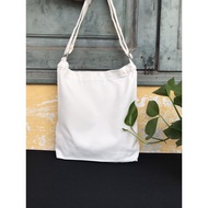 White canvas crossbody bag