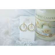 Round loop with pink tear drop earring