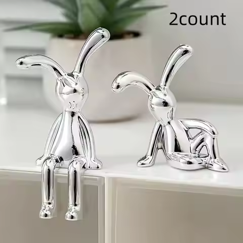 Two modern silver-plated resin rabbit figurines would be the perfect Easter gift for friends.