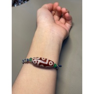 Dzi bracelet with 9 red eyes mixed with Tibetan copper charm