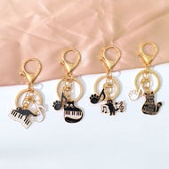 Music creative cute cat keychain piano note bag pendant couple car keychain hanging decoration gift音