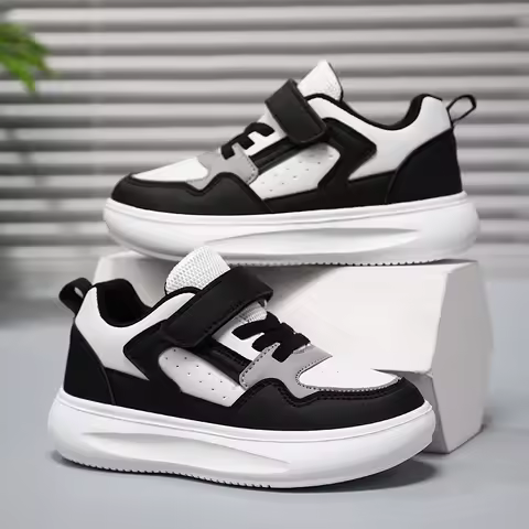 A pair of children's four-season leather sport shoes, wear-resistant, comfortable, soft leisure shoe