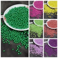 Package of 20g 5mm flat pearls in assorted colors to attach to costumes