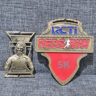 Medal finisher running Rcti Reds Run 5k