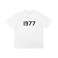 เสื้อยืดคู่รักแขนสั้นพิมพ์ลาย FOG ANGFG 1977 ทรงหลวม คอตตอน ระบายอากาศได้ดี สำหรับผู้ชายและผู้หญิง
