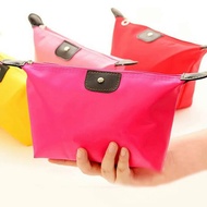 Spot dumpling makeup bag candy color dumpling bag will carry women holding dumpling type cosmetic bag