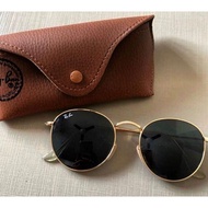 Round Rayban sunglasses.