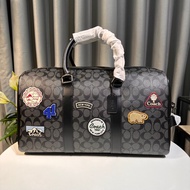 C0ach Venturer travel bag with eye-catching patterns