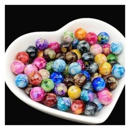 (35 grains) 8 mm PATTERNED ROUND BEADS