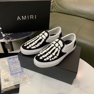 2025 New 【Original】 Amiri กระดูกนิ้วบุคลิกภาพแนวโน้มแฟชั่นผู้ชายและผู้หญิงรองเท้าผ้าใบลำลองต่ำรองเท้