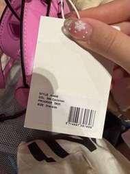 GANNI mini saddle-style bag in Cyclamen pink