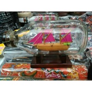 Miniature Display Of The Ship In A Medium Size Bottle