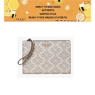 BEG00147 : Kate Spade Spade Flower Coated Canvas Wristlet French Cream