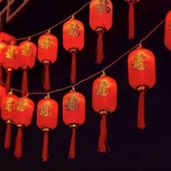 Decorative lantern curtain lights with the word joy