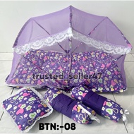 Red polka dot baby bedding set with mosquito net and pillows.