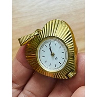 QQ MECHANICAL watch pendant.