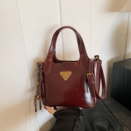 Glossy wrinkled leather women's handbag - Convenient duo, with stylish bell chain hanger K662