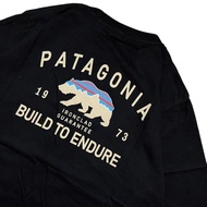 🎉【HOT】 เสื้อยืด พิมพ์ลาย Patagonia BUILD TO ENDURE สีดํา เสื้อยืดผู้ชาย Unisex