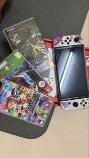 Nintendo Switch OLeD Console with Mario Kart 8, Monster Hunter Rise, FIFA 24