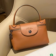 Longchamp cognac PU leather crossbody bag set with 4 bags and carrying case. Brown leather bags with