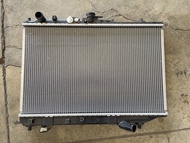หม้อน้ำ MAZDA PROTEGE รหัส PA66-GF30 ซีดาน 323  ของใหม่ ของแท้  ** กรุณาแชทสอบถามก่อนสั่งซื้อ **
