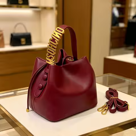 2026 New Light Luxury Drawstring Bucket Bag Trendy Gold Letter Handheld Crossbody Bucket Bag for Wom