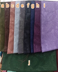 Kain meteran wolfis embos motif daun
