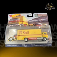 Hotwheels Team Transport Porsche 962 yellow model car