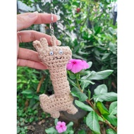 Alpaca wool keychain has fur and reveals seductive tanned skin