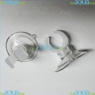 Aquarium rubber pipe hubcaps attached to glass