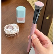 Blush brush, pink-handled foundation brush
