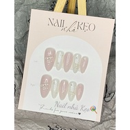 K76-nail box designed with snow emulsion and silver bow charm.