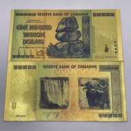Uang Kuno Zimbabwe 100 Triliun Dolar Foil Emas Unik - Simbol Batu dan Kerbau - Reserv Bank Zimbabwe