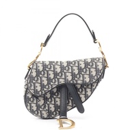 Christian Dior 迷你馬鞍斜背包，提花皮革，米色、海軍藍、黑色